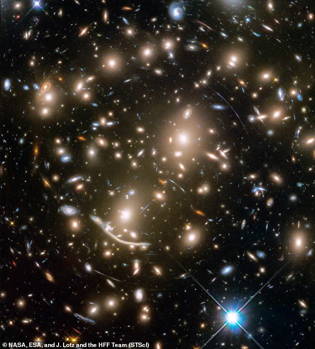 Observations from the Hubble Space Telescope (photo) show that the universe is expanding faster than the standard model would predict. This does not fit with the idea that dark energy leads to steady expansion. Pictured is a cluster of galaxies as seen by the Hubble Space Telescope