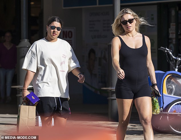 Kristie, a midfielder for West Ham United, completed her athletic ensemble with a pair of black sandals and shielded her eyes with dark square sunglasses