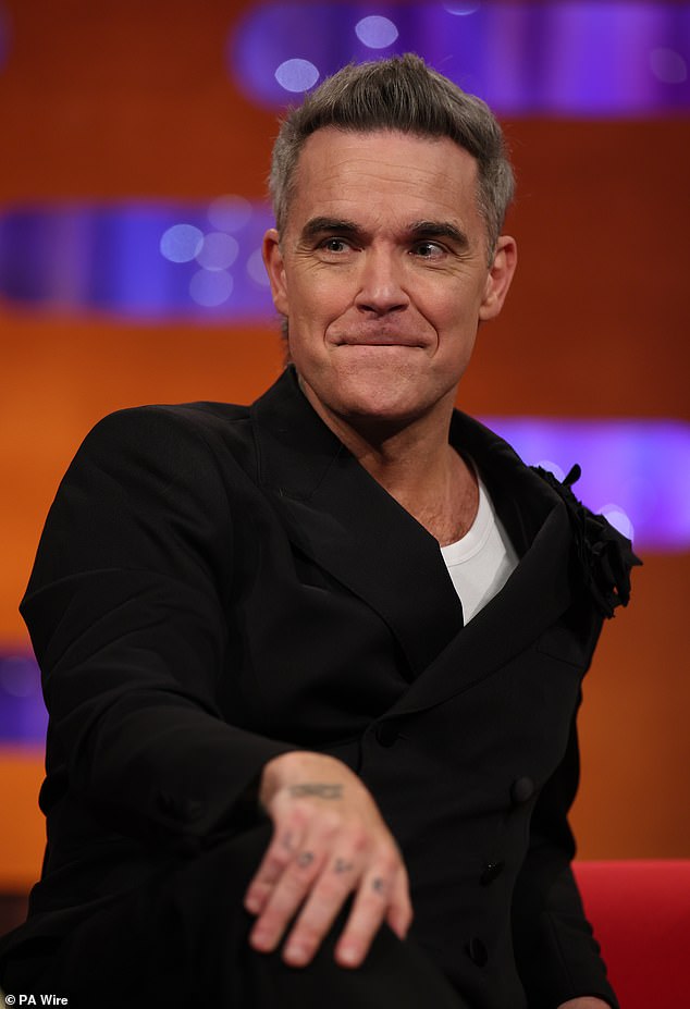 Robbie described the performance as the 'perfect' way to end the year after his new biopic, Better Man, was filmed in Melbourne with the help of Australian director Michael Gracey.