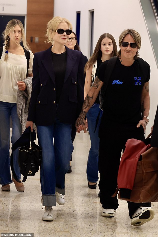 Nicole was spotted at Sydney International Airport with her husband Keith Urban and their two daughters Sunday Rose, 16, and Faith Margaret, 14 (all pictured)