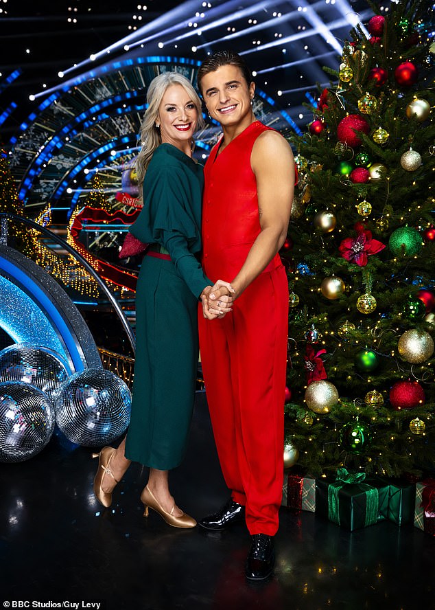 In their couple's photo, Tamzin Outhwaite looked festive in a green dress and gold shoes, while her partner Nikita Kuzmin was dressed in an all-red ensemble.