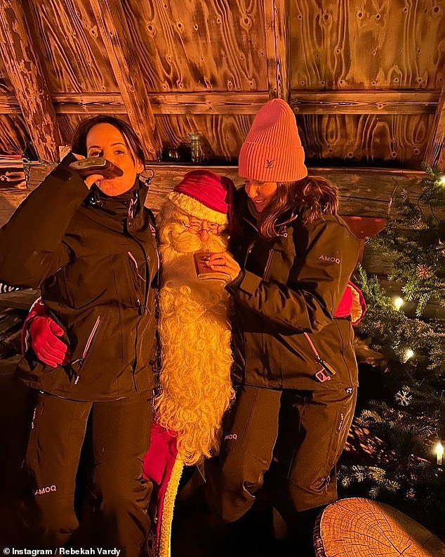 In another photo, it looks like Becky got drunk on Santa himself as she posed pouring a drink from a bottle into his mouth