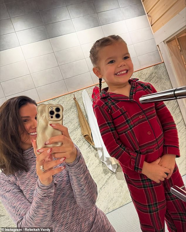 In another photo, she posed for a mirror selfie with her four-year-old daughter Olivia, who she shares with footballer husband Jamie