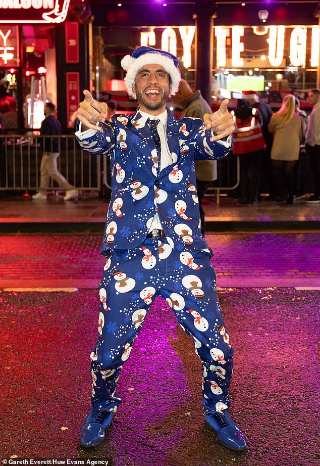 CARDIFF: A reveler channels his inner Frosty as he steps out in the most Christmassy blue suits