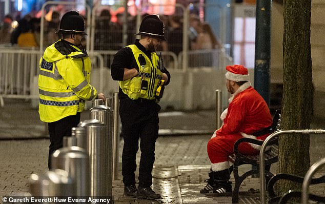 CARDIFF: Police stop for a chat with Santa Claus as he takes a break from the current delivery on a nearby park bench