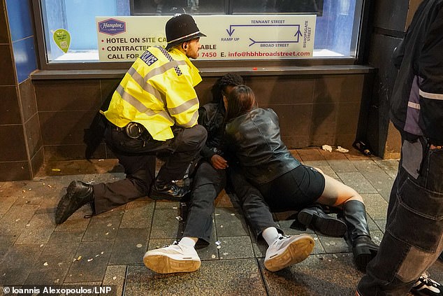 BIRMINGHAM: Two partygoers lie on the ground during Black Eye Friday in central Birmingham