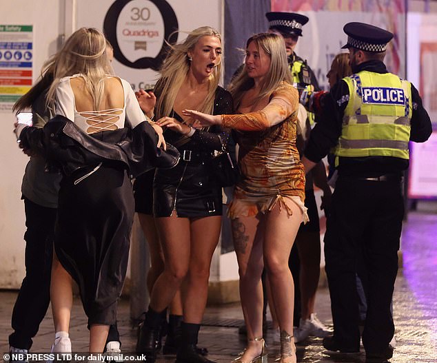 LEEDS: Police officers also approach a group of young girls who are in the northern city