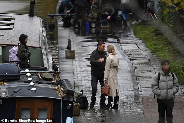 In one shot, the actor leans in to kiss her on the cheek and whisper something in her ear, while another shows them having a tense conversation