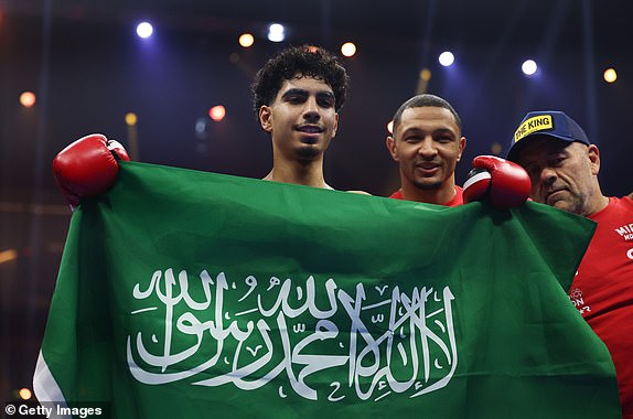 RIYADH, SAUDI ARABIA – DECEMBER 21: Mohammed Alakel celebrates victory with the flag of Saudi Arabia after the lightweight fight between Mohammed Alakel and Joshua Ocampo as part of Oleksandr Usyk v Tyson Fury 2, Reignited card at Kingdom Arena on December 21 2024 in Riyadh, Saudi Arabia. (Photo by Richard Pelham/Getty Images)