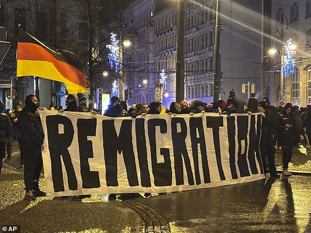 Some protest participants held up a visible banner with the word 'Remigration'