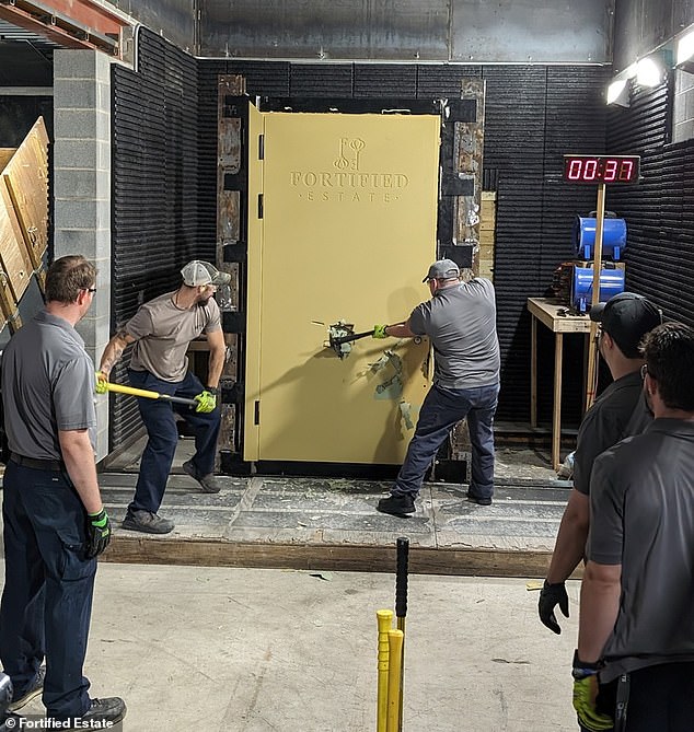 In the photo: Fortified Estate employees demonstrate the impenetrability of a door fitting