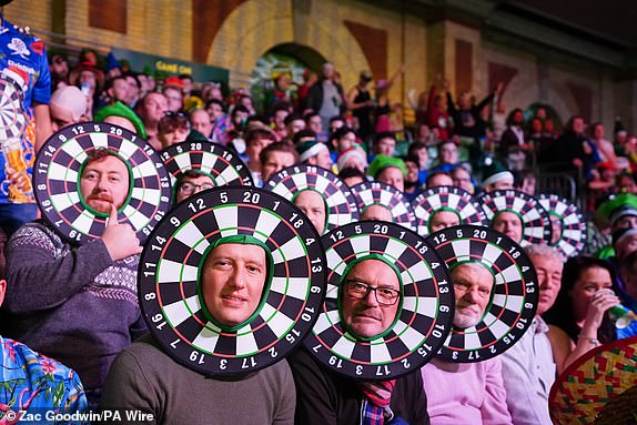 A general view of spectators in fancy dress during day seven of the Paddy Power World Darts Championship at Alexandra Palace, London. Date of photo: Saturday, December 21, 2024. PA Photo. See PA story DARTS World. Photo credit should read: Zac Goodwin/PA Wire. RESTRICTIONS: Use subject to restrictions. Editorial use only, no commercial use without prior permission from the rights holder.