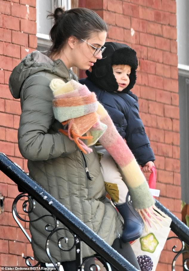 The clinical psychologist - who also shares a two-year-old son with the Broadway star - stepped out for a chilly walk in a snowy New Jersey neighborhood while pushing their little one in a stroller