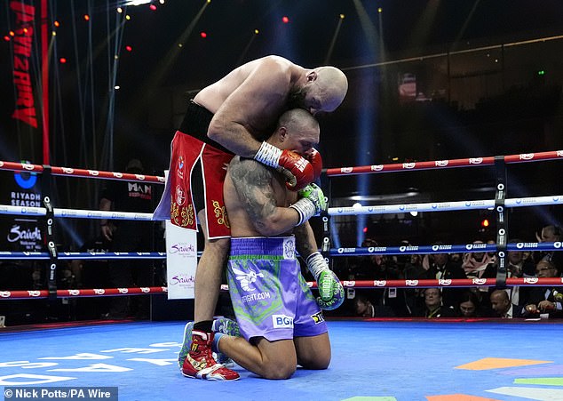 Usyk fell to his knees after the final bell and hugged Fury before the final result was announced