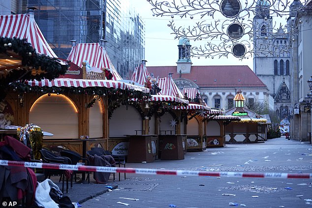 The somber scene as police surrounded the deserted market in Magdeburg yesterday