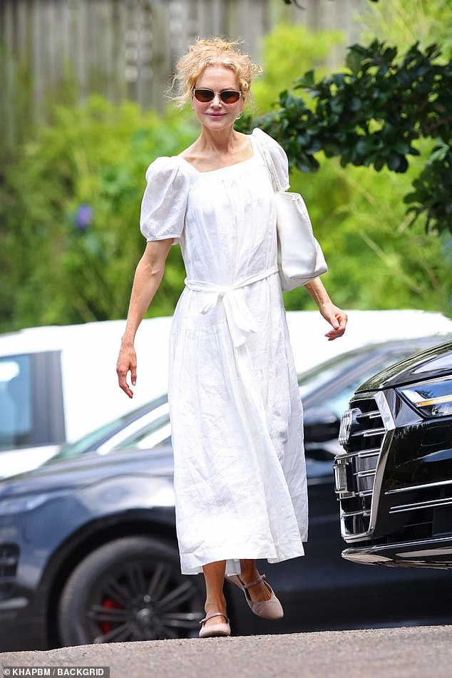 The Australian actress, 57, dressed to impress in a white dress as she left the service at the same church where she said goodbye to her mother Janelle just two months ago