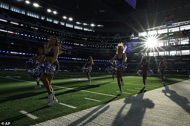 The sun shines through the glass windows at the end of AT&T Stadium in Arlington, Texas