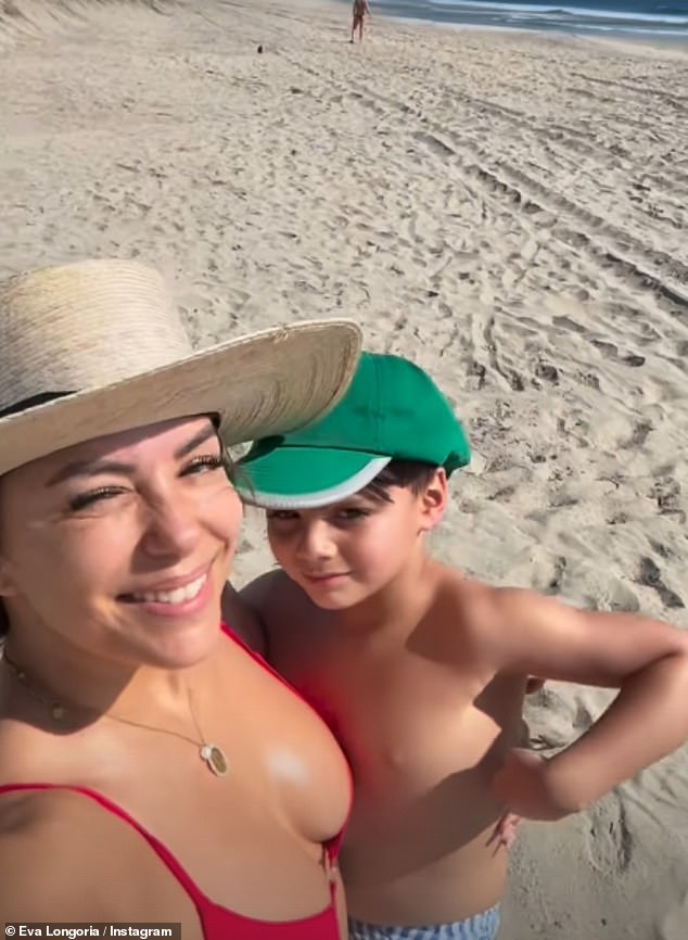 In the clips shared to her Instagram Story, Eva carried Santiago in her arms as they walked on the beach and The Desperate Housewives star looked stunning as she shielded her eyes with a wide-brimmed cream hairdo.