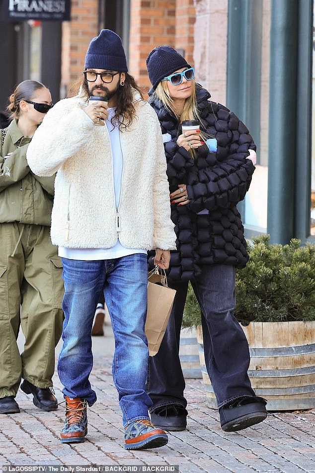 The supermodel and guitarist appeared to be having a relaxing time as they strolled through the celebrity's favorite ski resort, sipping hot drinks