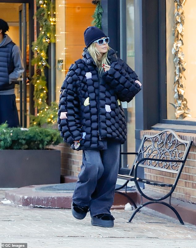 The America's Got Talent judge was ready for the Colorado outing as she wore a quirky black and multicolored quilted oversized coat over baggy black jeans and chunky snow boots