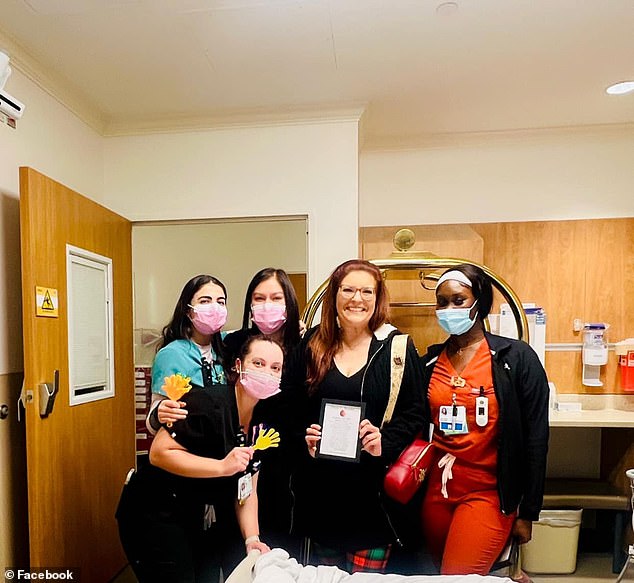 Misty poses with the nurses who helped her during her kidney transplant after being cleared to leave the Houston Methodist Transplant Unit on December 6