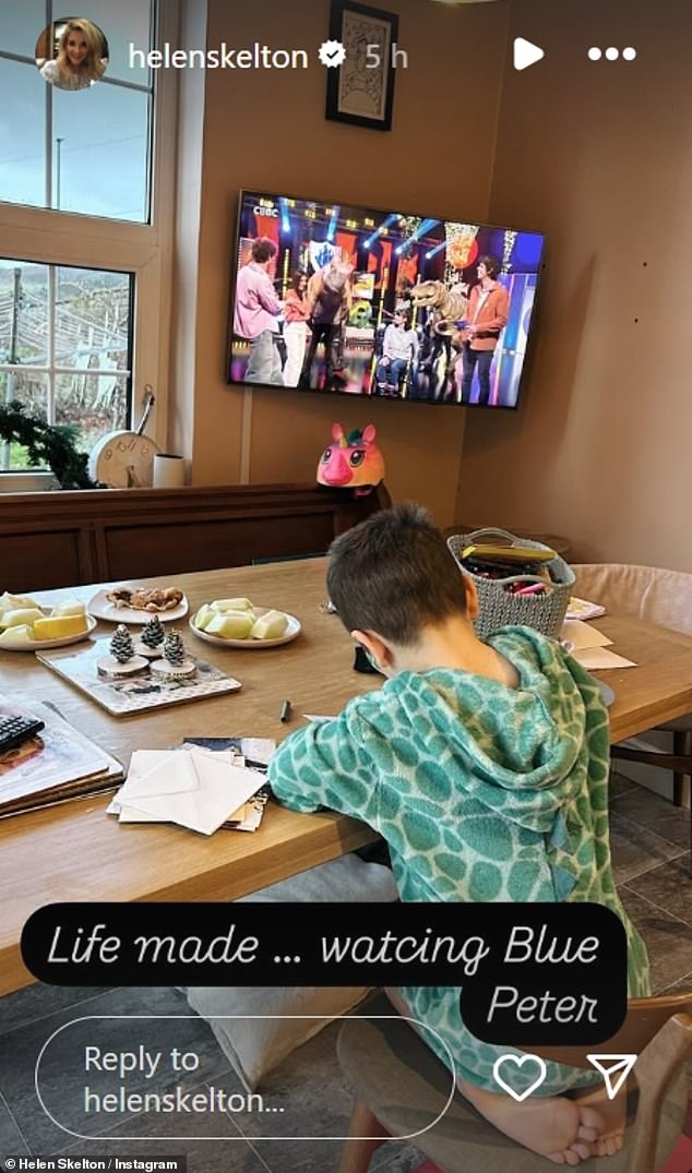 In a heartwarming moment shared to the star's Instagram Story on Sunday, Helen showed her son coloring on a large table dressed in a dinosaur onesie with an episode of the hit show playing in the background