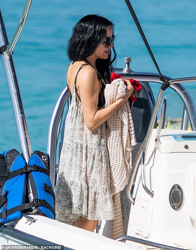 She also hopped aboard a boat as she left the wintry Irish weather behind and soaked up the rays