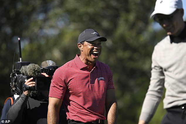 Woods couldn't believe his eyes after watching Charlie make a hole-in-one on the fourth hole