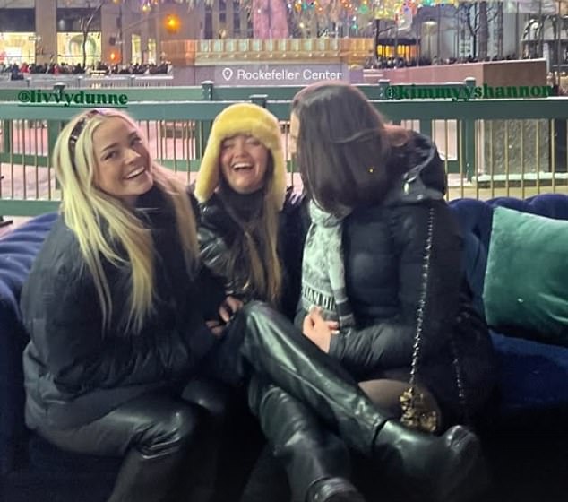 She also posed with sister Julz (center) and a friend on the Rockefeller Center Christmas tree