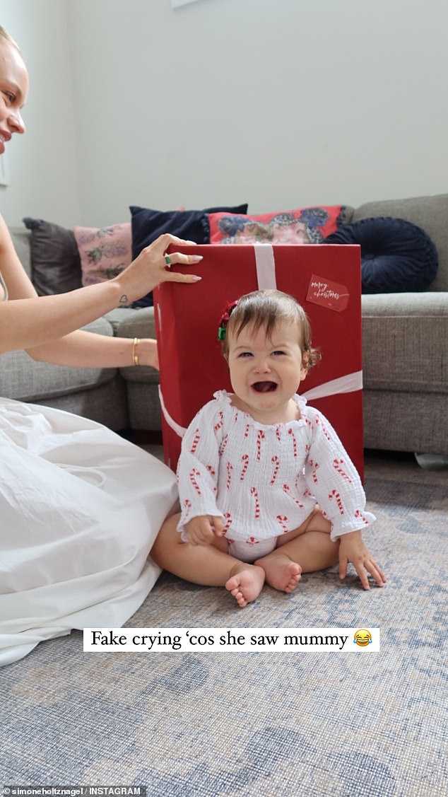 Simone posted sweet photos from the 'Holtznagel family Christmas', which showed two Madeline unwrapping presents with the little toddler