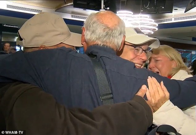 It was an emotional meeting as Dixon, centered, hugged his three siblings for the first time