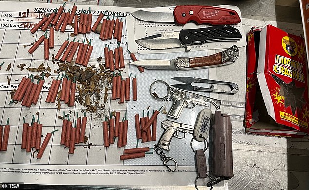 The officer found 82 fireworks, three knives, two replica firearms and a can of pepper spray – all prohibited in carry-on luggage