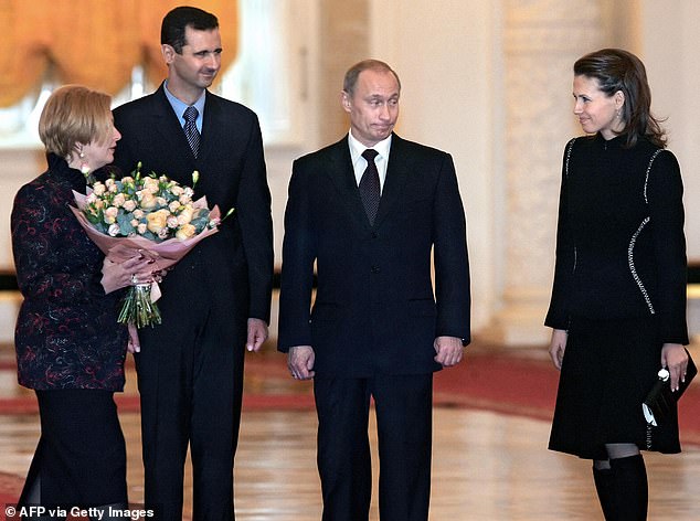 Bashar and Asma Al-Assad are pictured meeting with Vladimir Putin in 2005