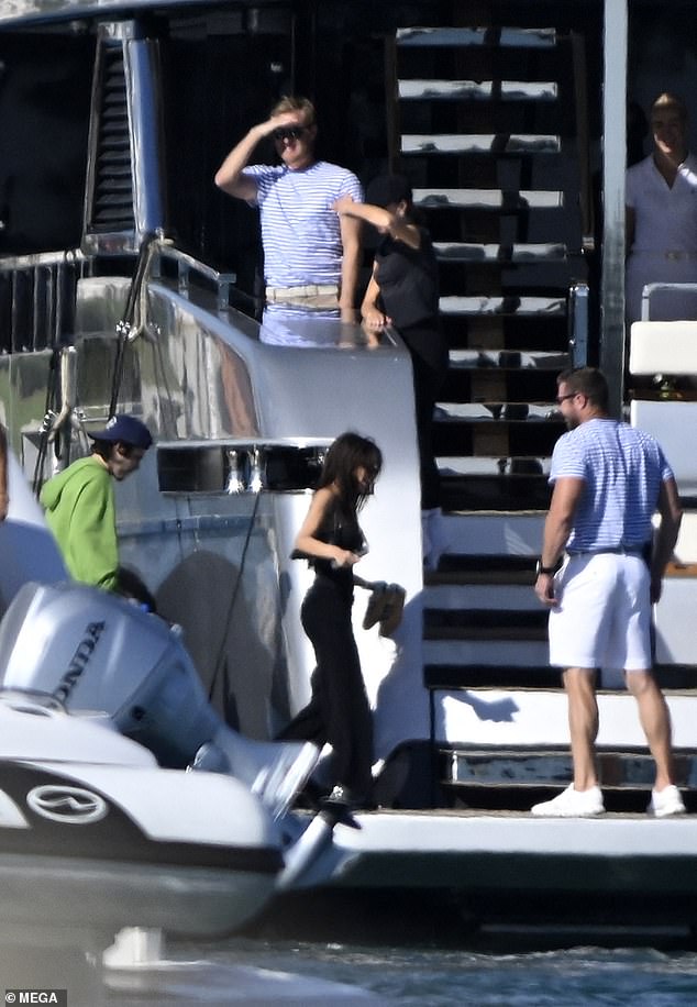 Members of the yacht's crew were seen helping the family during the journey