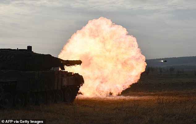 Ukrainian ground forces fire a Leopard 2A4 tank during field training at a secret location in Ukraine, October 27