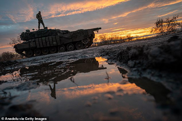 Ukrainian soldiers from the 33rd Brigade pilot a Leopard battle tank towards Kurahove, Ukraine, as the war between Russia and Ukraine continues on December 19