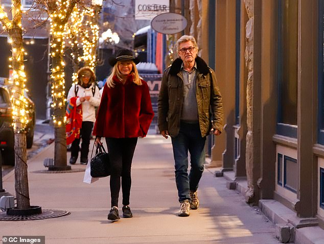 She carried a large Overland shopping bag in one hand, while the Tombstone actor was wrapped in a fur and denim jacket.