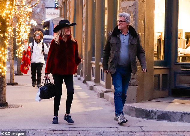 Goldie completed the look with a black tote bag as the pair appeared in good spirits, laughing and chatting as they strolled through the streets