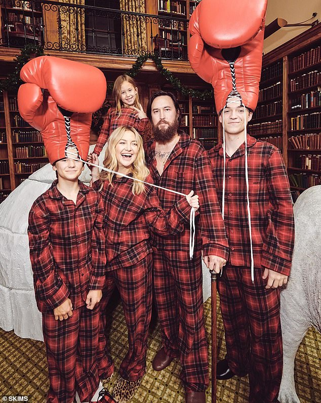 Kate, her sons and her daughter posed with Danny while her two boys wore giant boxing gloves on their heads