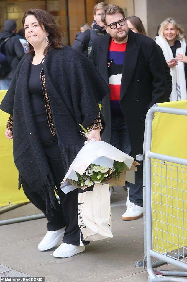 Ruth clutched a bouquet of flowers as she led them outside