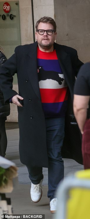 James, the co-creator of Gavin and Stacey, cut a smart figure in a colorful striped sweater and black coat