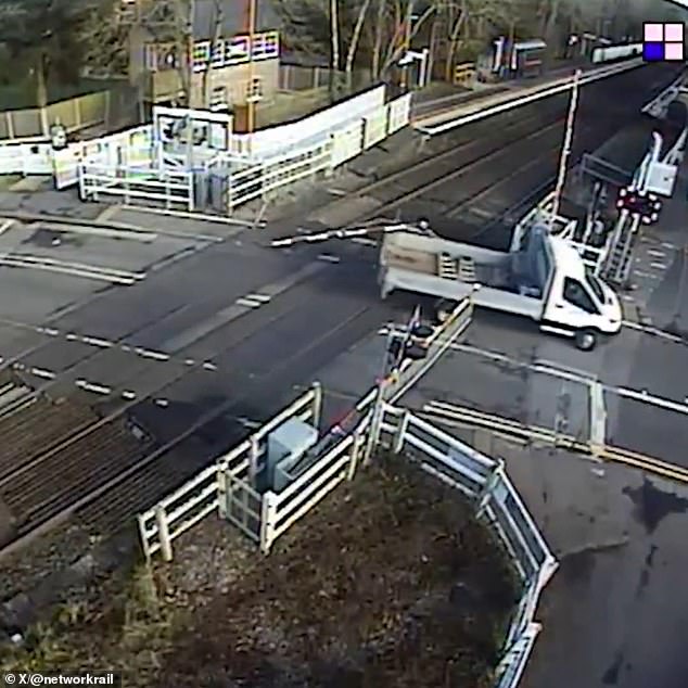 More footage showed a truck trying to cross when the barrier came down, but got caught on the back of the vehicle and was dragged along the tracks