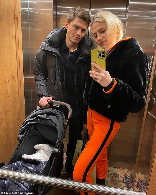 Pixie donned an orange version of the ski suit and a short black fur coat over it on another outing as she posed with Oliver at the £1,800-a-night 5-star Kulm Hotel