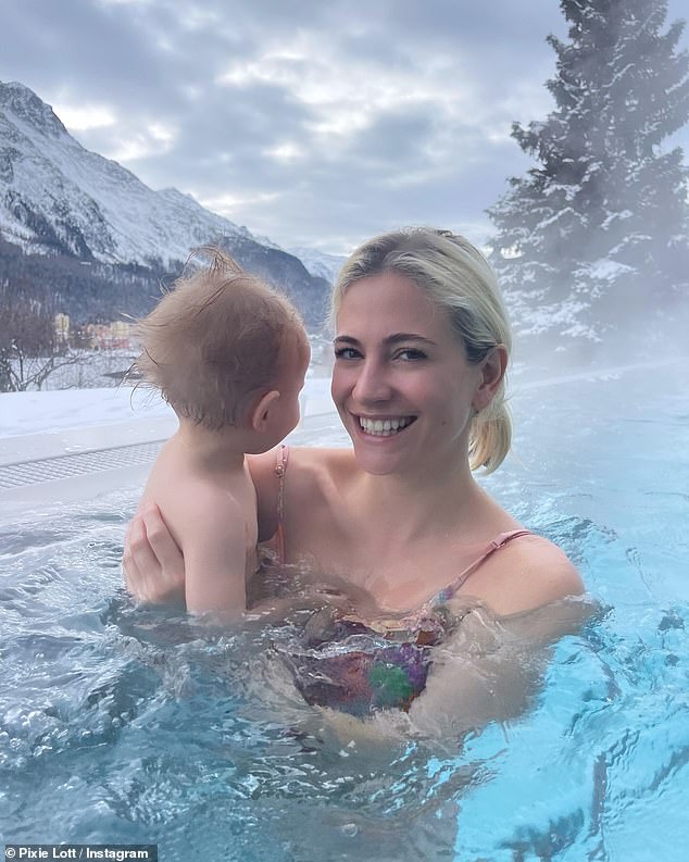 Pixie made the most of the lavish winter outing, donning a colorful floral swimsuit as she went for a swim with Albert in a heated outdoor pool