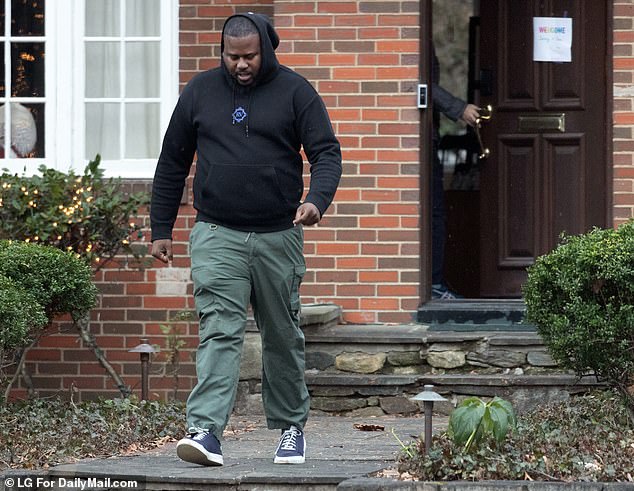 A private security guard leaves the Fauci residence after an outing