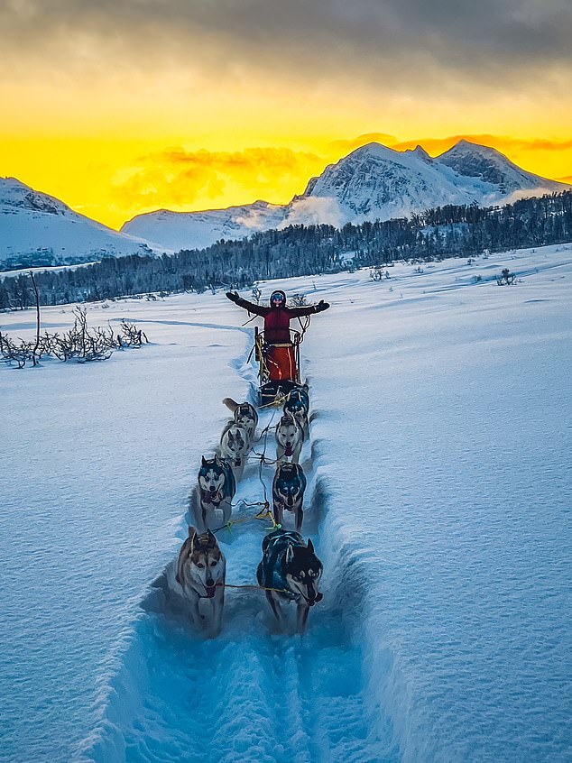 The scenery is spectacular as the dogs pull Ida-Helene through a snow tunnel