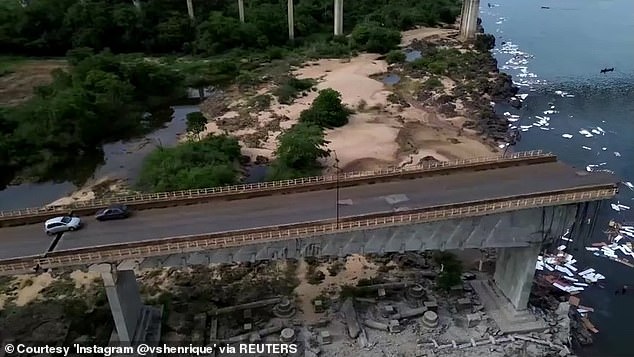 Authorities said two trucks fell into the river, dumping about 120,000 liters of sulfuric acid and about 22,500 liters of insecticides and herbicides.