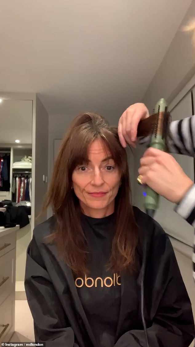 Michael then cut stylish bangs for Davina and chatted with watching fans in the process, one of whom joked in the comments: 'Bangs are cheaper than Botox'