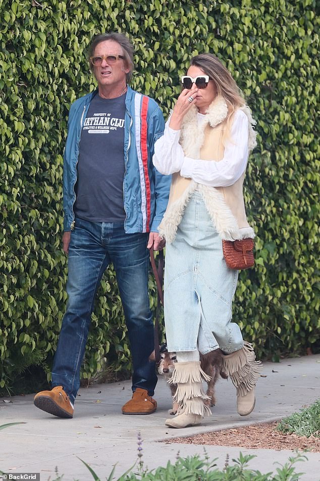 Bochner looked cool while heading to the popular Brentwood Country Mart for lunch with a friend. He wore a gray shirt with a blue striped flight jacket, jeans and light brown suede clogs