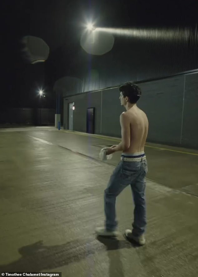 The livestream ended with Timothée — still shirtless — walking out of the venue to a rain-soaked loading dock near a train track, humming to himself.